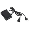 A black foot pedal for a sewing machine with its power cord and plug. Náhľad obrázku produktu
