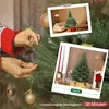 A person is decorating a Christmas tree, with inset images showing the tree before and after decoration. Produktbild-Vorschau