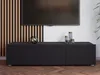 A black TV cabinet with decorative items on top, placed in front of a wall with wooden slats and a mounted television. Produktbild-Vorschau