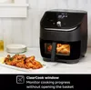 An Instant Pot Vortex Plus Airfryer is shown on a kitchen counter next to a plate of chicken wings. The airfryer has a clear window showing food inside. Produktbild-Vorschau