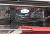 Inside view of a dishwasher showing the interior and a light. Produktbild-Vorschau