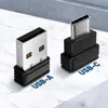 Two USB adapters are shown on a marble-like surface. Anteprima dell’immagine prodotto