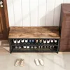 A shoe rack with a wooden top and metal frame, filled with shoes, placed in a hallway. Podgląd zdjęcia produktu