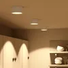 Three white LED ceiling lights are mounted on a textured ceiling above a row of white cabinets. Produktbild-Vorschau