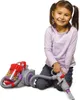 A young girl is playing with a toy vacuum cleaner. Produktbild-Vorschau