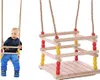 A baby is sitting on a wooden swing, and a separate image shows the swing itself. Produktbild-Vorschau