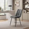 A dark gray upholstered chair with black metal legs is placed in a modern home office setting. Produktbild-Vorschau