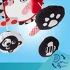 A close-up view of a baby mobile with various hanging toys, set against a light blue background with a diagonal overlay. Produktbild-Vorschau