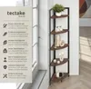 A corner shelf unit with decorative items on display, next to a window. Náhled obrázku produktu