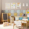 A child's playroom with educational posters, a chalkboard, building blocks, and a small table and chairs. Náhled obrázku produktu