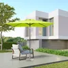 An outdoor patio scene with a modern house, a chair, and a green umbrella. Produktbild-Vorschau