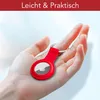 A hand holding a red silicone case for an Apple AirTag. Produktbild-Vorschau