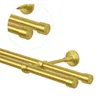 A close-up view of a double curtain rod in a brass gold finish, showing the mounting brackets and end caps. Anteprima dell’immagine prodotto