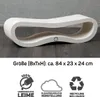 A white, curved cat scratching post or furniture piece is shown on a dark wooden floor against a textured gray wall. Below the product are three icons with German text. Produktbild-Vorschau