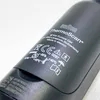 A close-up view of the branding and regulatory markings on a black Braun ThermoScan thermometer. Produktbild-Vorschau