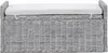 A close-up, front-facing view of a wicker storage bench with a white cushion. Náhled obrázku produktu