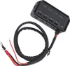 A black electronic device with wires and connectors, likely a fuse block or relay box, is shown against a white background. Voir les images du produit