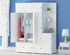 A white modular closet filled with clothes and decorative items, placed in a room with a blue wall and white curtains. Náhled obrázku produktu