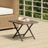 A small square table with a tray of fruit and drinks on a wooden deck. Anteprima dell’immagine prodotto