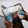 A person is playing a racing game on a tablet. Anteprima dell’immagine prodotto