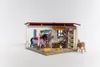 A toy horse stable playset with figures and accessories. Produktbild-Vorschau