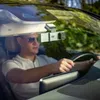 A man driving a car with a dashcam mounted on the windshield. Produktbild-Vorschau