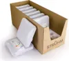 A cardboard box containing multiple packaged light fixtures, with two fixtures partially removed from the box. Voir les images du produit
