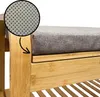 Close-up of a bamboo shoe rack with a gray seat cushion, highlighting the texture of the cushion. Produktbild-Vorschau