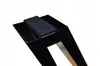 Close-up view of the corner of a black metal table leg with a felt pad attached. Náhled obrázku produktu