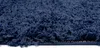 A close-up, side view of a dark blue shaggy rug. Produktbild-Vorschau