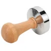 A coffee tamper with a wooden handle and a silver base. Náhled obrázku produktu