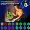 A young boy is looking at a 3D soccer ball night light that is lit up in yellow. Below the main image, there are multiple soccer ball lights shown in different colors. Produktbild-Vorschau