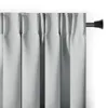 A close-up view of light gray curtains hanging from a curtain rod. Produktbild-Vorschau