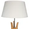 A close-up shot of a white lampshade on a wooden lamp base. Podgląd zdjęcia produktu