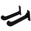 Two black acrylic wall mounts for yoga mats, shown against a white background. Podgląd zdjęcia produktu