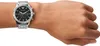 A person's wrist wearing a silver and black Emporio Armani chronograph watch. Náhled obrázku produktu