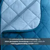 Close-up of a quilted blanket showing the stitching and texture. Produktbild-Vorschau