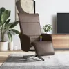 A brown leather recliner chair with a footrest extended, placed on a rug in a living room setting with a TV and wooden cabinet in the background. Produktbild-Vorschau