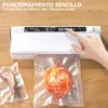 A hand is shown pressing a button on a white vacuum sealer machine, with vacuum-sealed food items (a piece of meat and a shrimp) placed on a wooden table in front of it. Produktbild-Vorschau