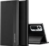 A black flip case for a smartphone is shown standing upright, with the phone partially visible inside. Produktbild-Vorschau