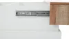 Close-up of a drawer slide mechanism on a white cabinet, with a textured brown wood edge visible on the right. Voir les images du produit