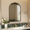 A bathroom vanity with a mirror, sink, faucet, and decorative elements. Podgląd zdjęcia produktu