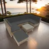 A rattan lounge set on a patio overlooking the ocean at sunset. Náhled obrázku produktu