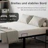 A bed frame with a mattress and pillows, with marketing text and diagrams overlaid. Voir les images du produit