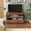 A TV stand with a TV and electronic devices in a living room setting. Podgląd zdjęcia produktu