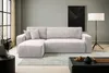 A modern living room with a light beige sectional sofa, a black coffee table, and a floor lamp. Produktbild-Vorschau