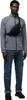 A man wearing a gray jacket, blue jeans, and a black fanny pack. Anteprima dell’immagine prodotto