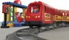 A toy train set at a station with people. Podgląd zdjęcia produktu