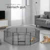 A living room scene with a dog playpen and two golden retrievers. Voir les images du produit