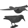 Two black bird decoys, one in flight and one perched, against a white background. Produktbild-Vorschau